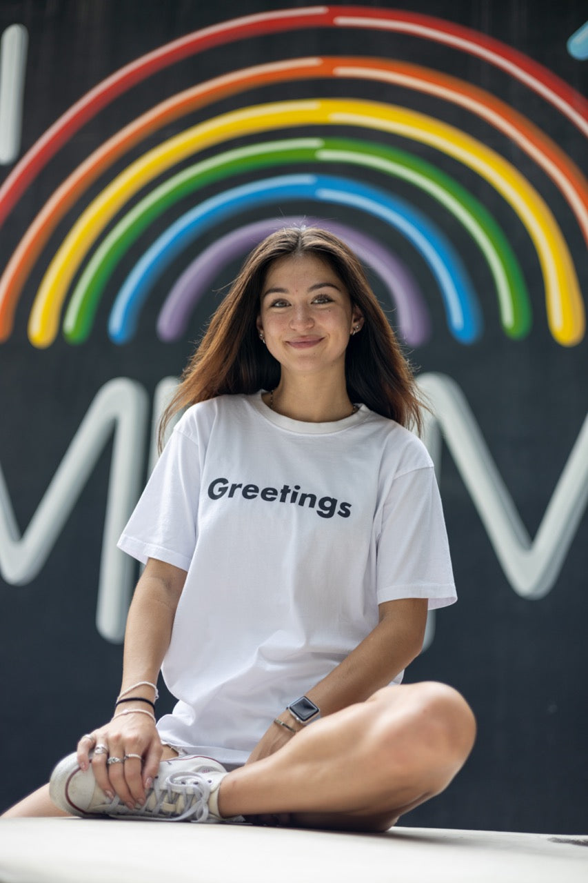 The Hi Greetings Greet T Shirt and Ciao Fuzzy Bucket Hat modeled by Dani Kott in Wynwood, Miami Florida