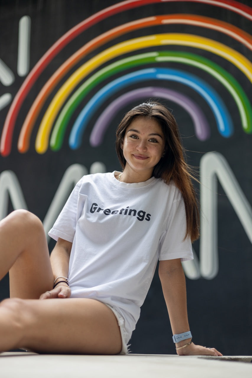 The Hi Greetings Greet T Shirt and Ciao Fuzzy Bucket Hat modeled by Dani Kott in Wynwood, Miami Florida