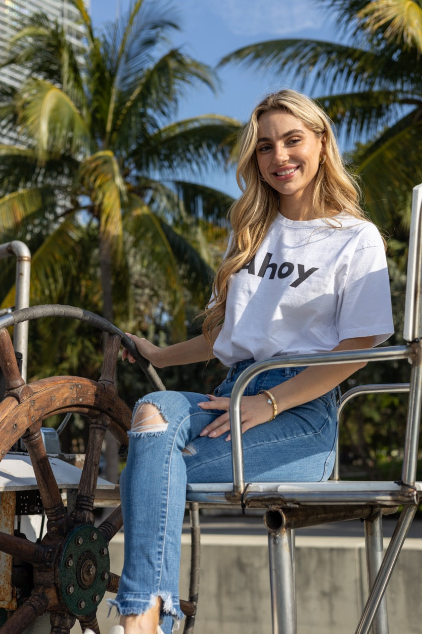 Hi Ahoy Nautical Friendly Greeting T shirt in white modeled by Kara Gault on a ship in Miami