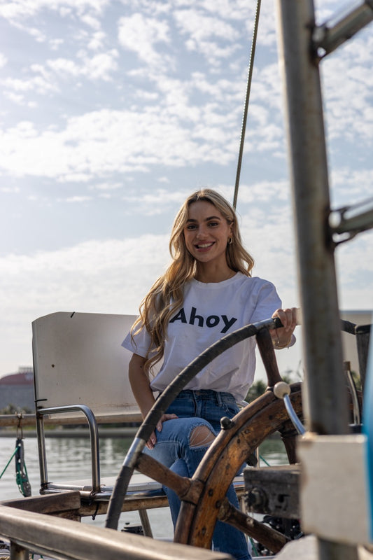 Hi Ahoy Nautical Friendly Greeting T shirt in white modeled by Kara Gault on a ship in Miami