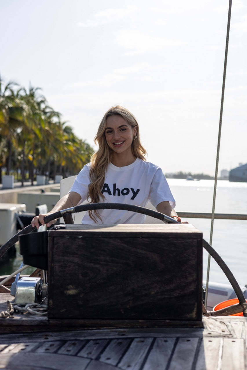 Hi Ahoy Nautical Friendly Greeting T shirt in white modeled by Kara Gault on a ship in Miami