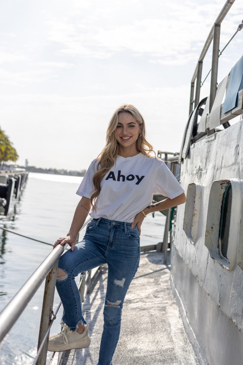 Hi Ahoy Nautical Friendly Greeting T shirt in white modeled by Kara Gault on a ship in Miami