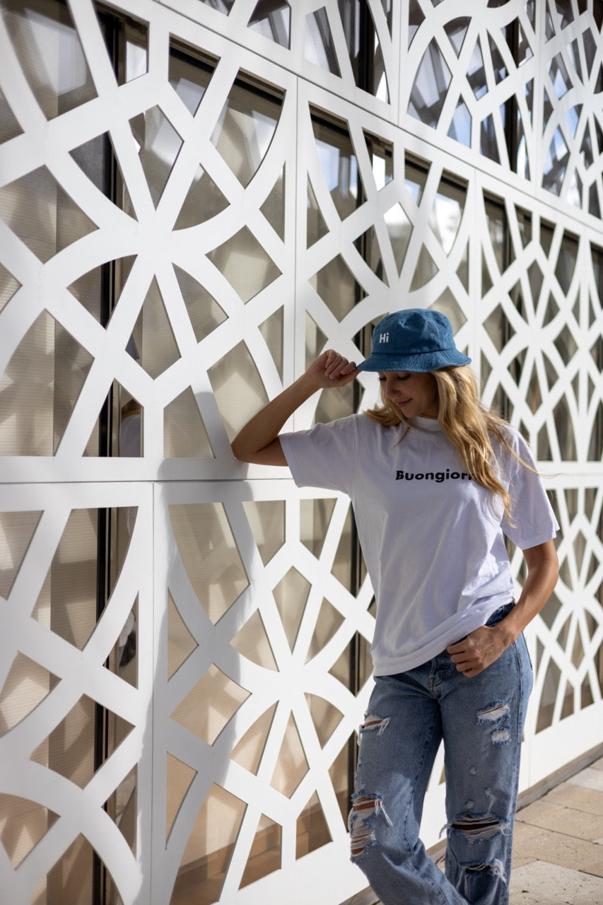 Hi Happy interactions Denim Bucket Hat in Light Blue Denim, modeled by Alia Buoniello in Miami Design District