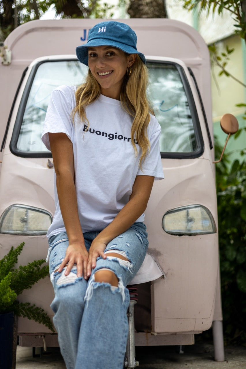 Alia Buoniello models the Hi Buongiorno Happy interactions Greet Tee Shirt in White at the Miami Design District