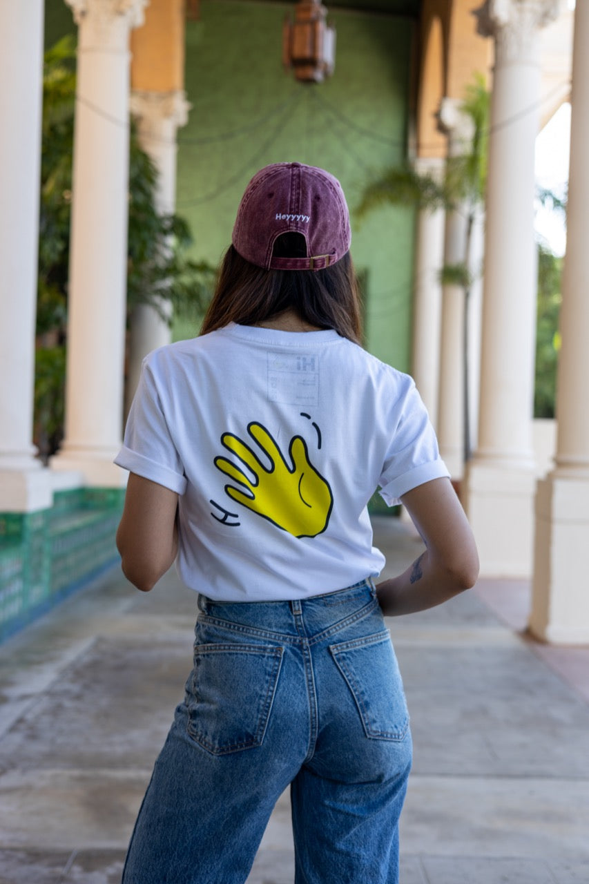 Hi Buenos Dias Spanish Good day Greeting T shirt in white, modeled by Rosa Abi at the Biltmore in Coral Gables Florida