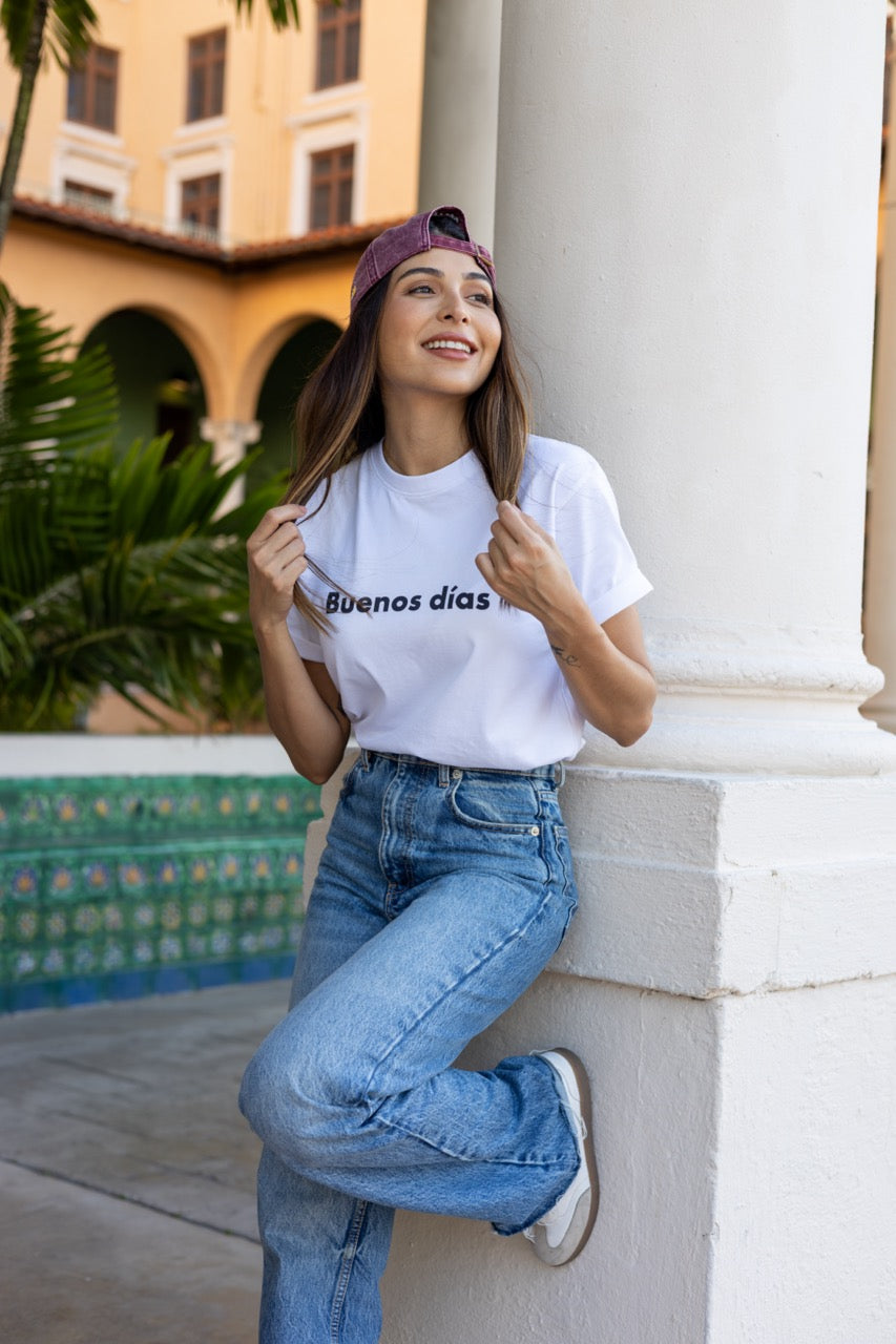 Hi Buenos Dias Spanish Good day Greeting T shirt in white, modeled by Rosa Abi at the Biltmore in Coral Gables Florida