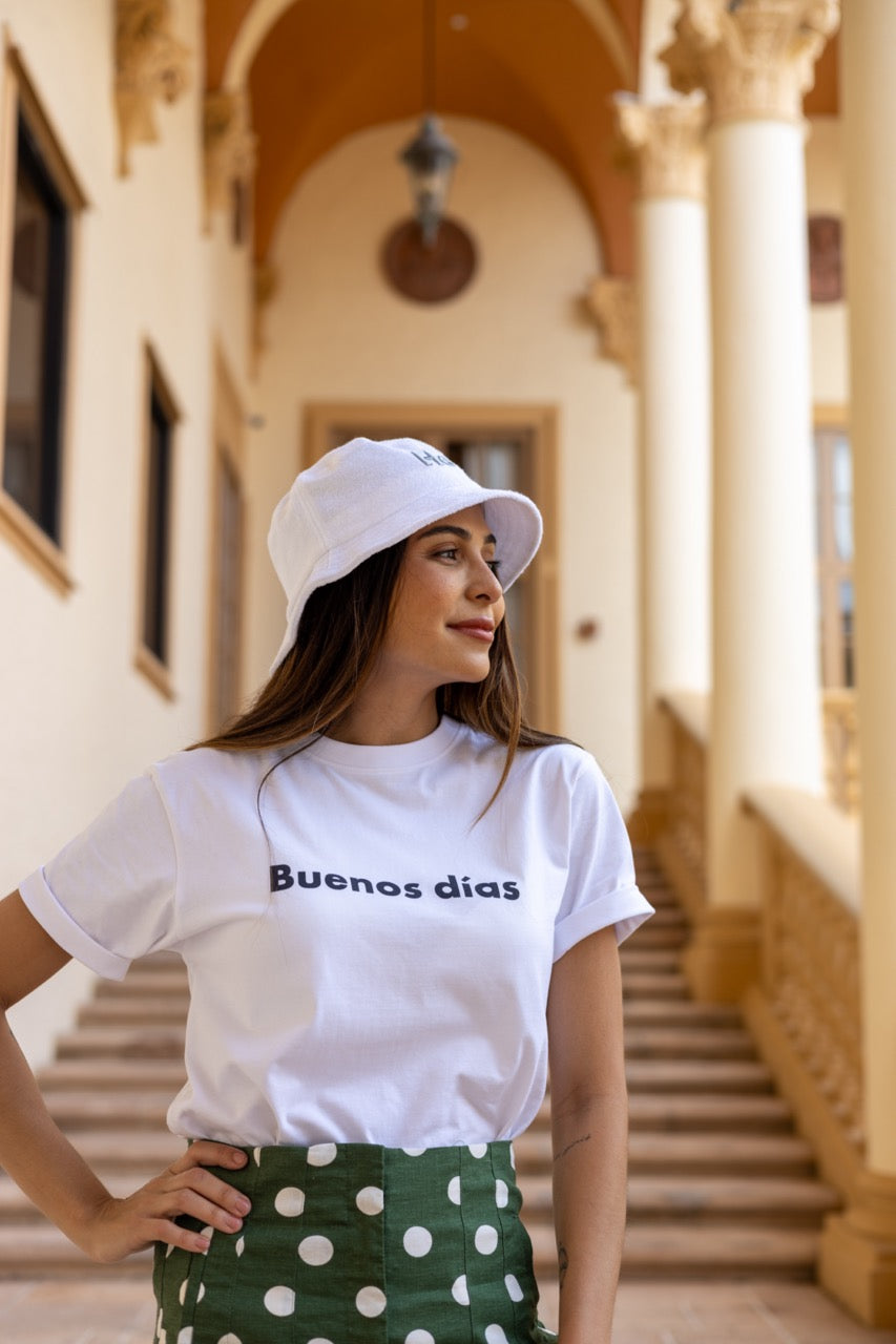 Hi Buenos Dias Spanish Good day Greeting T shirt in white, modeled by Rosa Abi at the Biltmore in Coral Gables Florida