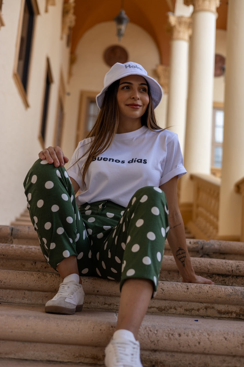 Hi Buenos Dias Spanish Good day Greeting T shirt in white, modeled by Rosa Abi at the Biltmore in Coral Gables Florida