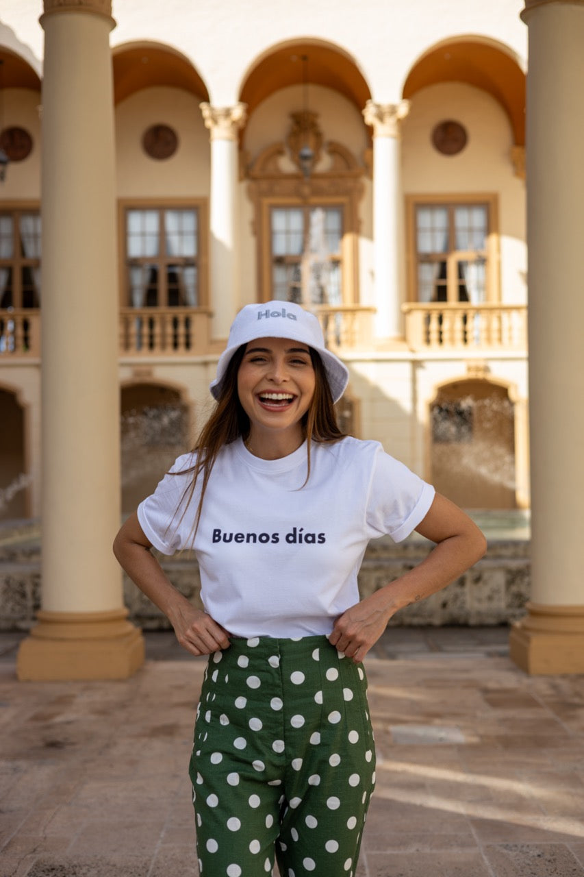 Hi Buenos Dias Spanish Good day Greeting T shirt in white, modeled by Rosa Abi at the Biltmore in Coral Gables Florida