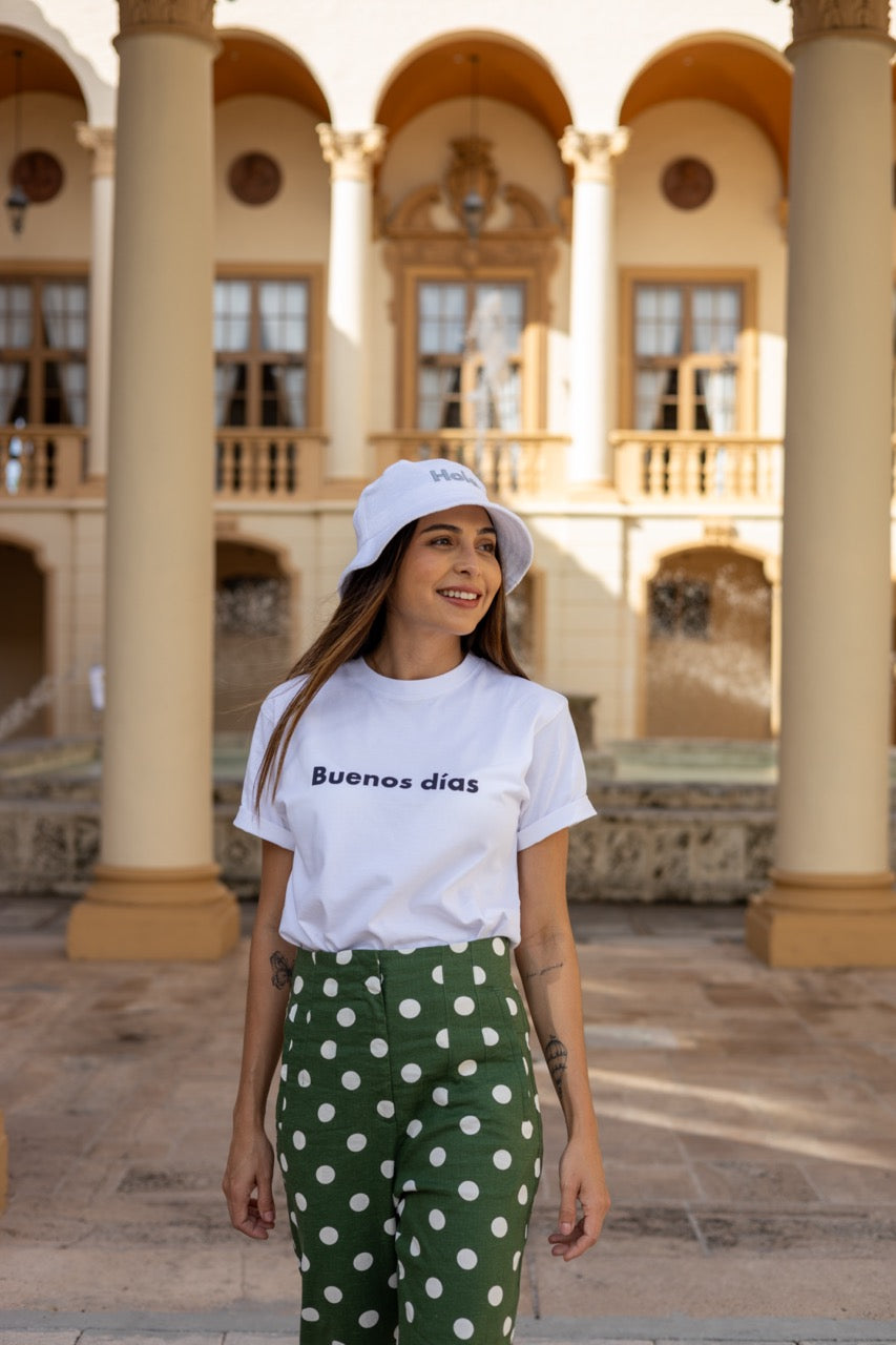 Hi Buenos Dias Spanish Good day Greeting T shirt in white, modeled by Rosa Abi at the Biltmore in Coral Gables Florida