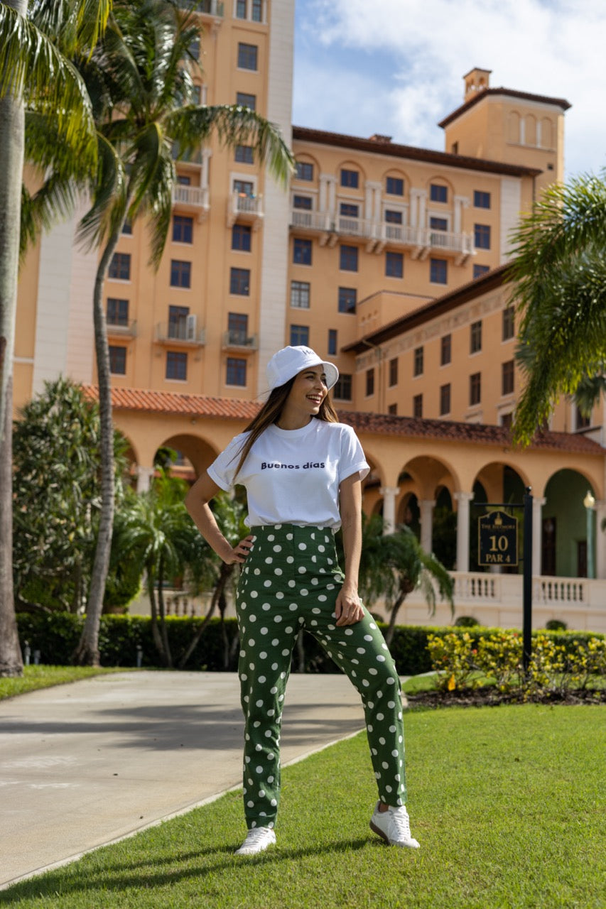 Hi Buenos Dias Spanish Good day Greeting T shirt in white, modeled by Rosa Abi at the Biltmore in Coral Gables Florida