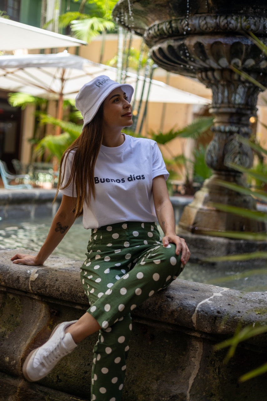 Hi Buenos Dias Spanish Good day Greeting T shirt in white, modeled by Rosa Abi at the Biltmore in Coral Gables Florida