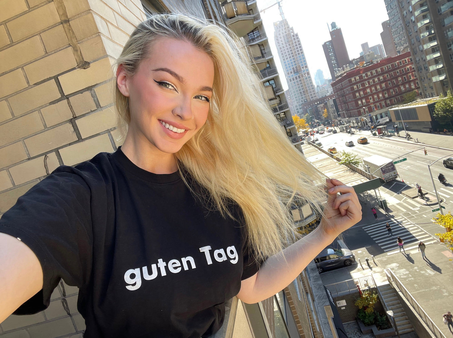 Hi Guten Tag German Greeting t shirt in black, modeled by Shannon Milligan in New York City
