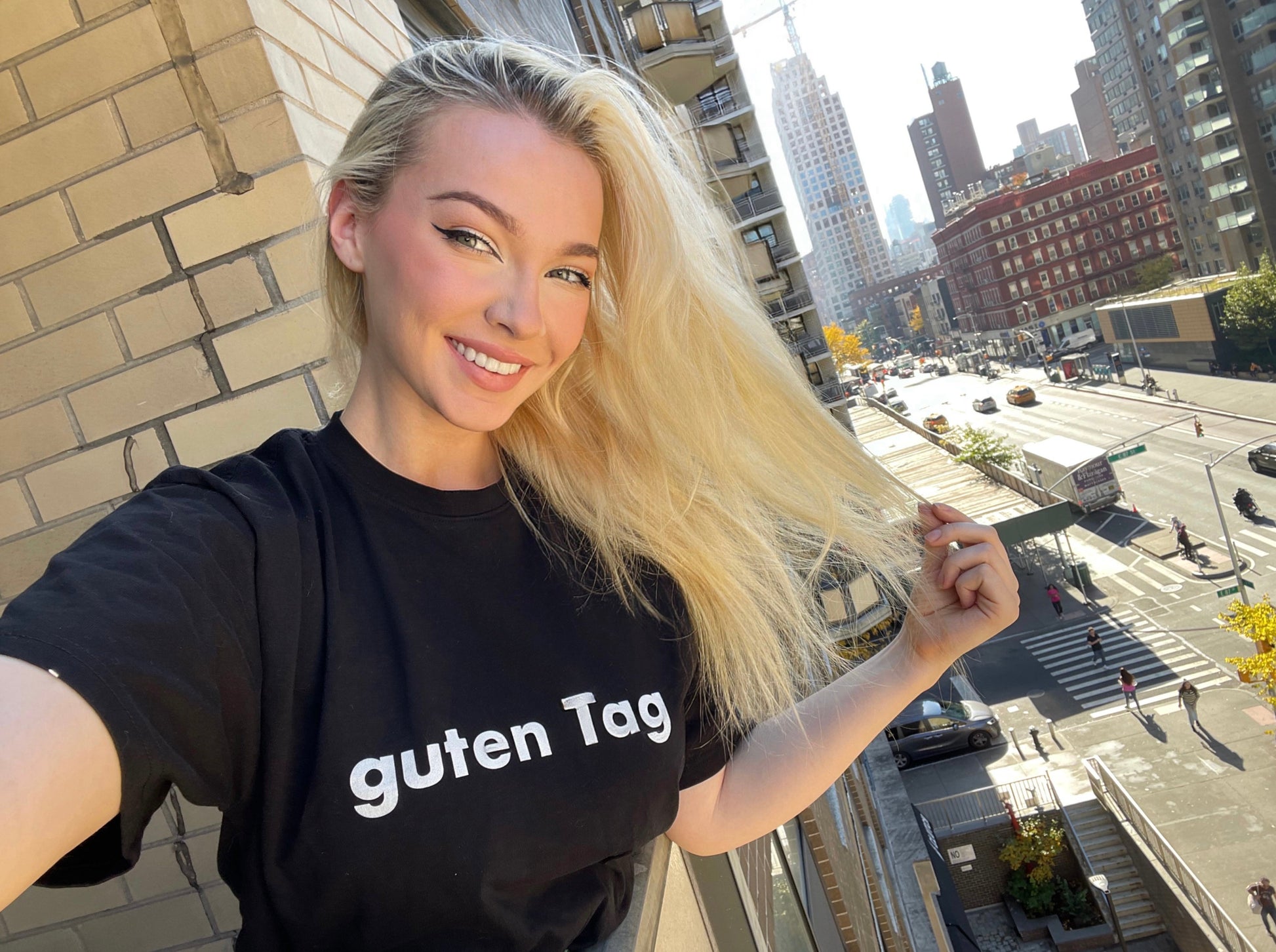 Hi Guten Tag German Greeting t shirt in black, modeled by Shannon Milligan in New York City