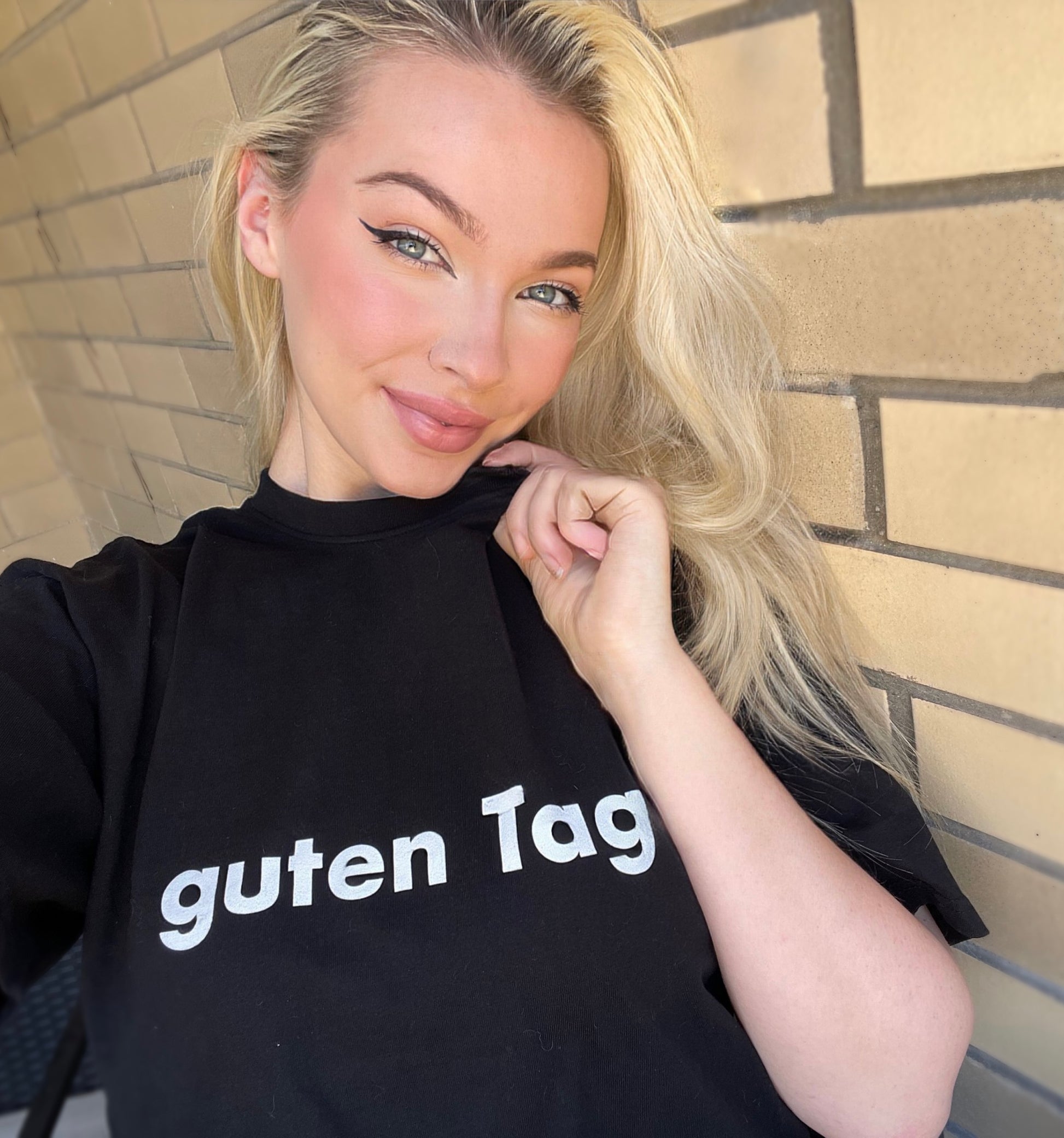 Hi Guten Tag German Greeting t shirt in black, modeled by Shannon Milligan in New York City