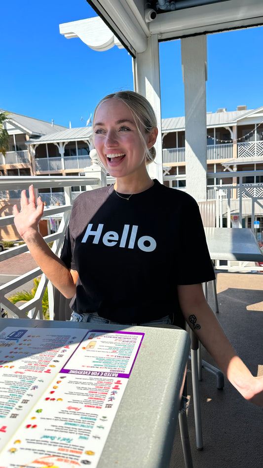 Hello Greet Tee Shirt from Happy interactions modeled by McKaylyn Zwieg in black 