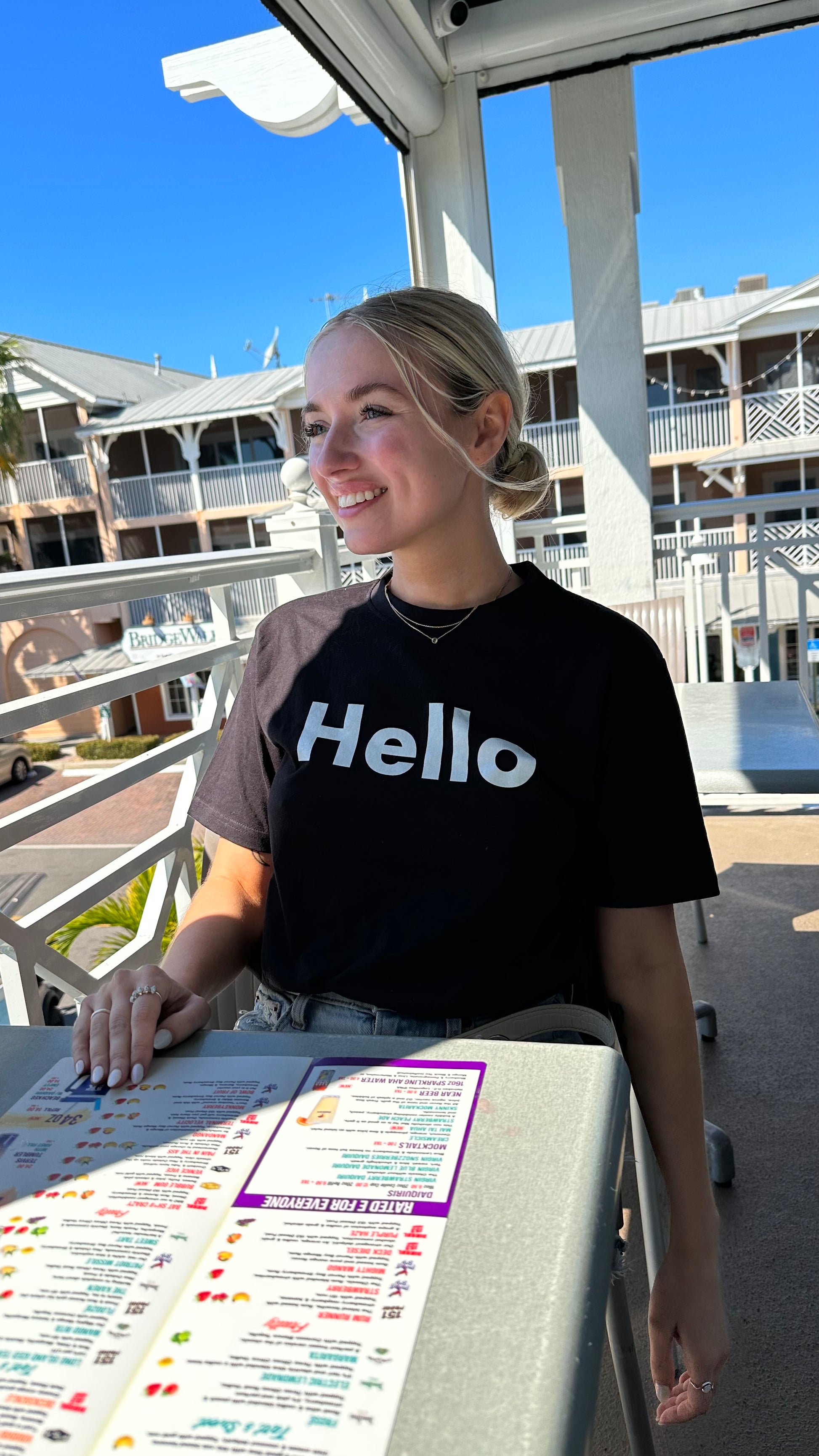 Hello Greet Tee Shirt from Happy interactions modeled by McKaylyn Zwieg in black