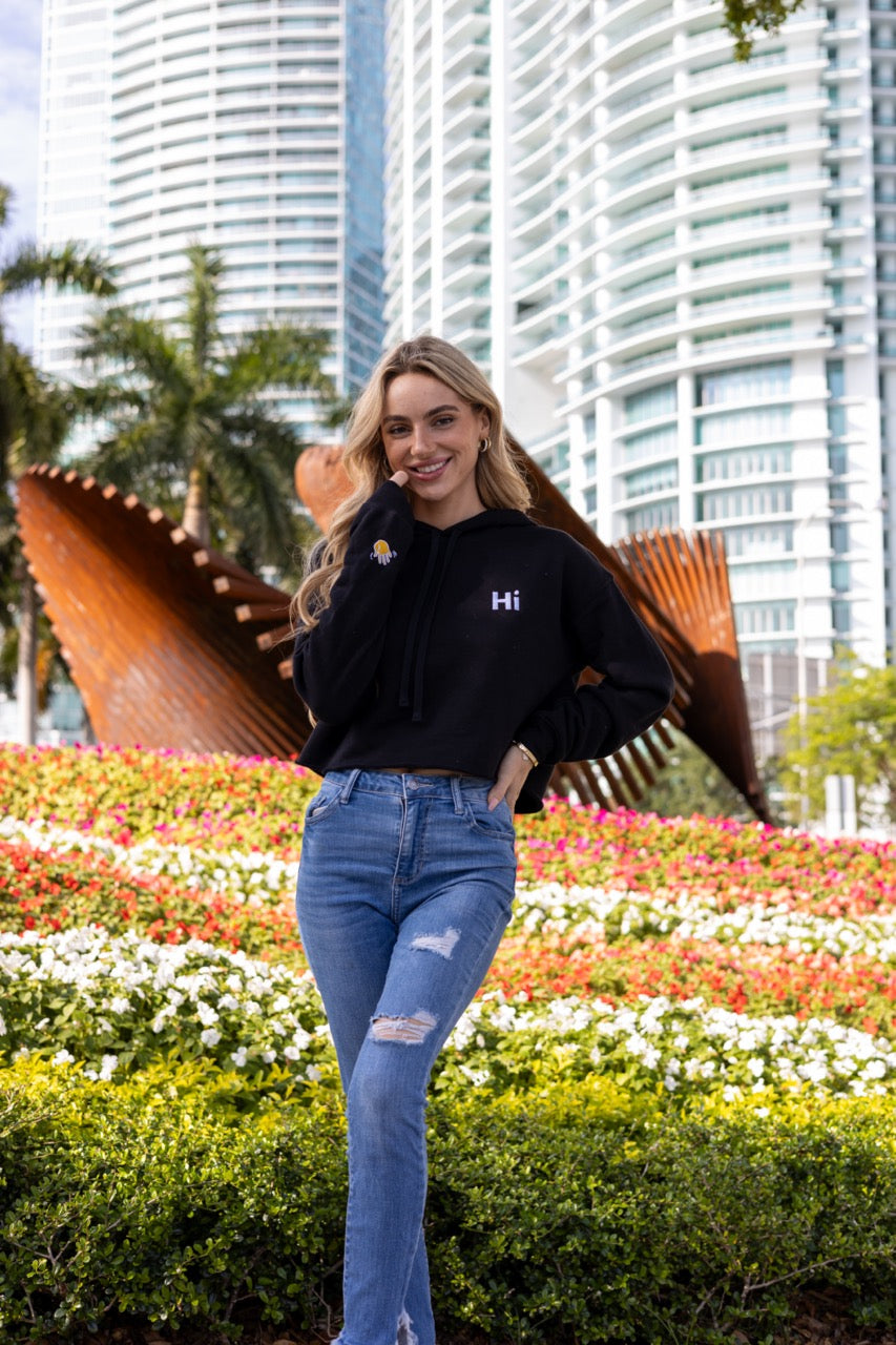 Hi 👋 Embroidered Cropped Hoodie in black modeled by Kara Gault photo by Johnny Michael