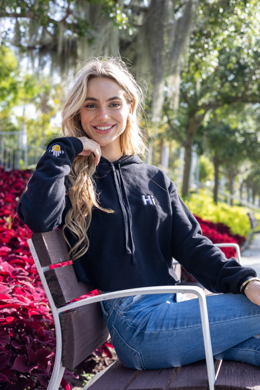 Hi 👋 Embroidered Cropped Hoodie in black modeled by Kara Gault photo by Johnny Michael for Happy interactions