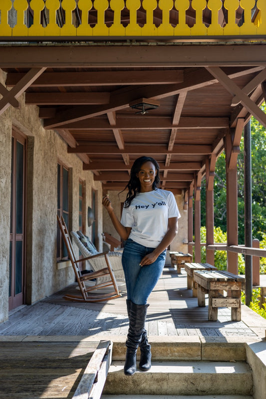 Hi Hey y'all Friendly Southern Greeting T shirt in white, modeled by Alyssa Ferguson at the Barnacle in Coconut Grove, Miami Florida