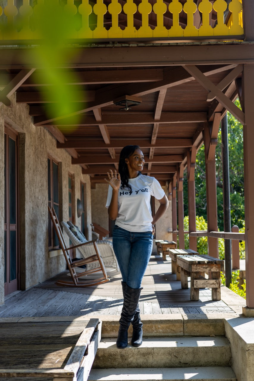 Hi Hey y'all Friendly Southern Greeting T shirt in white, modeled by Alyssa Ferguson at the Barnacle in Coconut Grove, Miami Florida