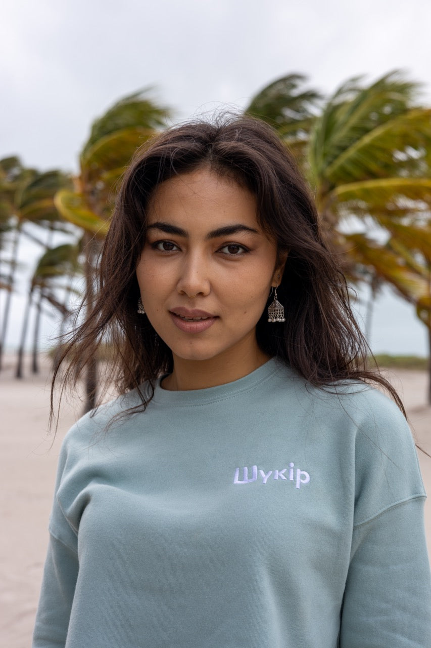Hi Cropped Sweatshirt in light green, modeled by Assiya Mukanova in Key Biscayne, Miami, Florida