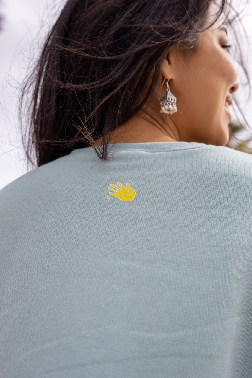 Hi Cropped Sweatshirt in light green, modeled by Assiya Mukanova in Key Biscayne, Miami, Florida
