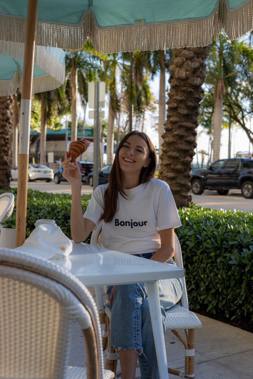 Hi Bonjour French Greeting t shirt in white modeled by Anastasia Ponomar in Edgewater, Miami Florida