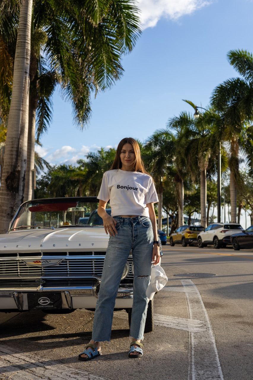 Hi Bonjour French Greeting t shirt in white modeled by Anastasia Ponomar in Edgewater, Miami Florida