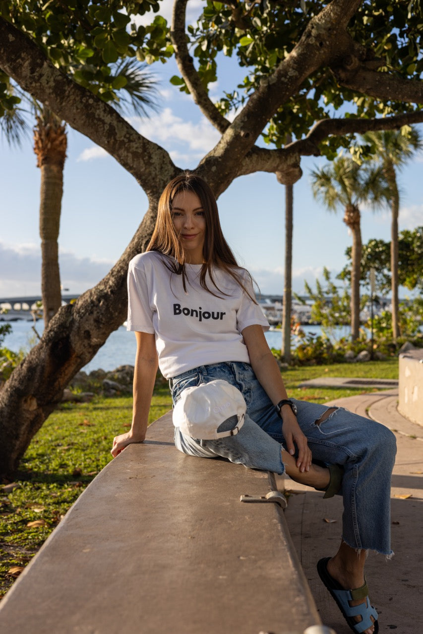 Hi Bonjour French Greeting t shirt in white modeled by Anastasia Ponomar in Edgewater, Miami Florida