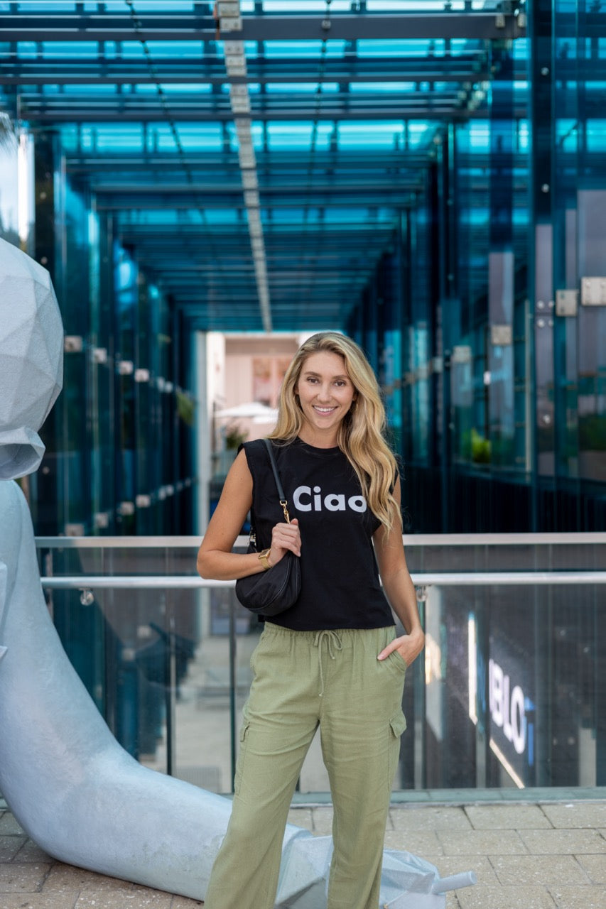 Alia Buoniello models the Hi Ciao Italian Greet Tee by Happy interactions in Black at the Miami Design District