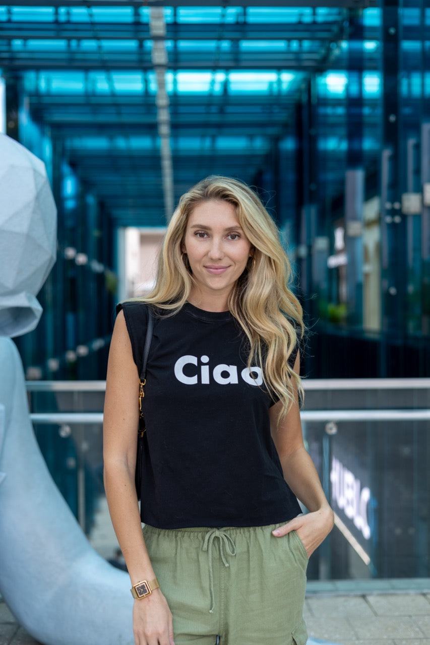 Alia Buoniello models the Hi Ciao Italian Greet Tee by Happy interactions in Black at the Miami Design District