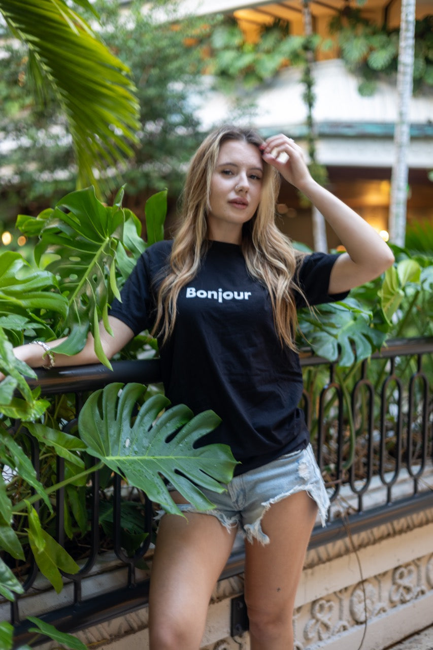 Alexandria LaChapelle models the Bonjour T Shirt for Happy interactions in black