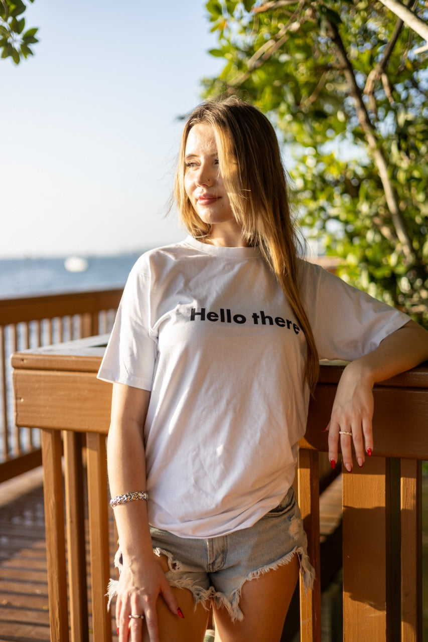 Alexandria LaChapelle models the Hello there Greet Tee Shirt for Happy interactions in black