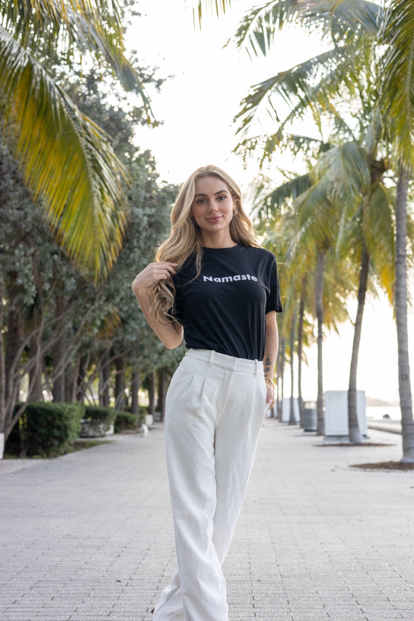 Hi Namaste Indian Greeting T Shirt in black, modeled by Kara Gault photographed by Johnny Michael at Maurice A. Ferré Park in Miami, Florida