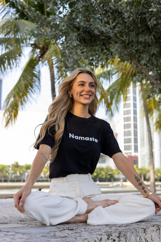 Hi Namaste Indian Greeting T Shirt in black, modeled by Kara Gault photographed by Johnny Michael at Maurice A. Ferré Park in Miami, Florida