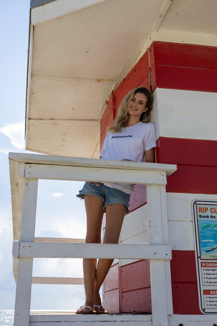 Hi Namaste Indian Greeting T Shirt in white, modeled by Claire photographed by Johnny Michael at Miami Beach South Pointe Park in Miami, Florida