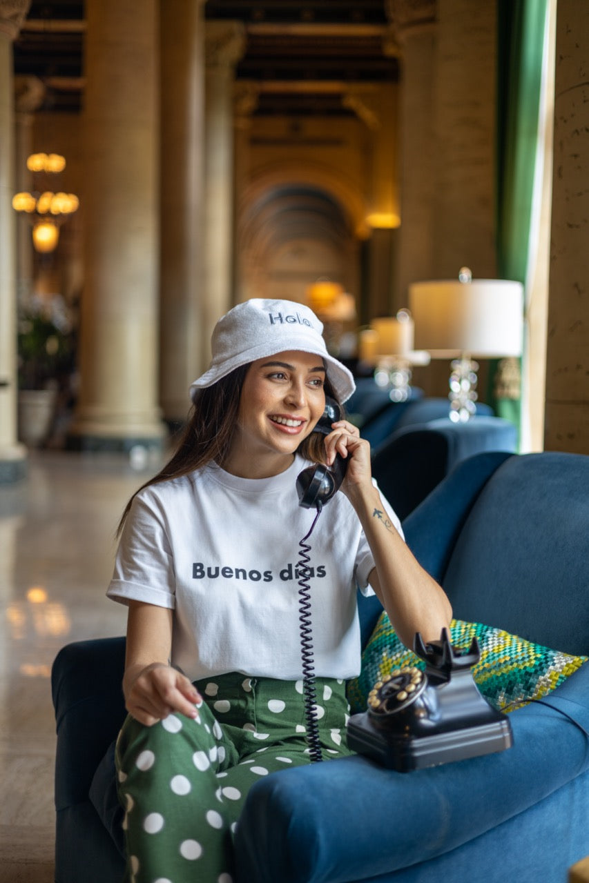 Rosa wears the Hi Hola Fuzzy Bucket Hat by Happy interactions at The Biltmore