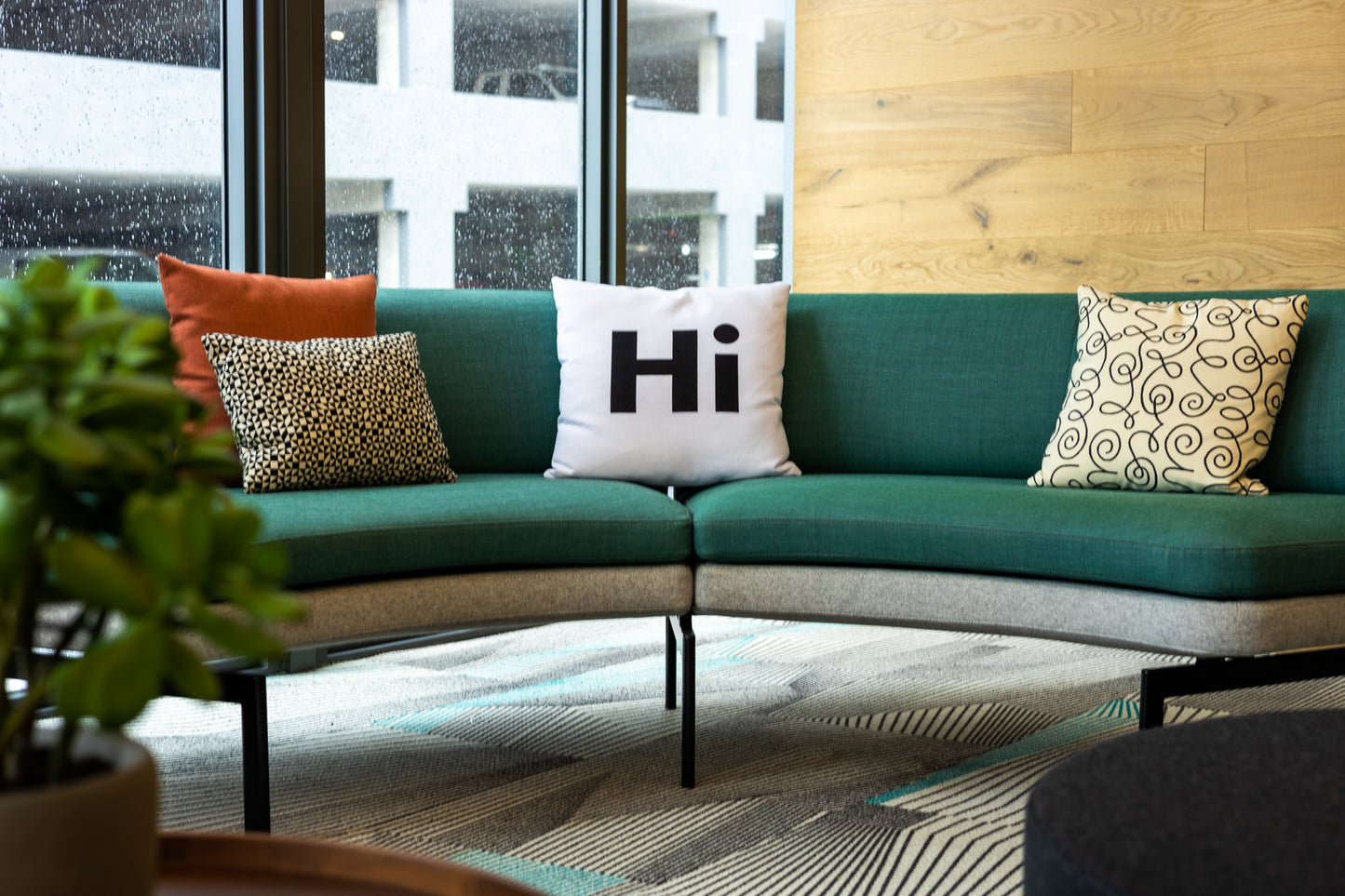 Hi Pillow by Hi Johnny in white in a coworking space lounge area