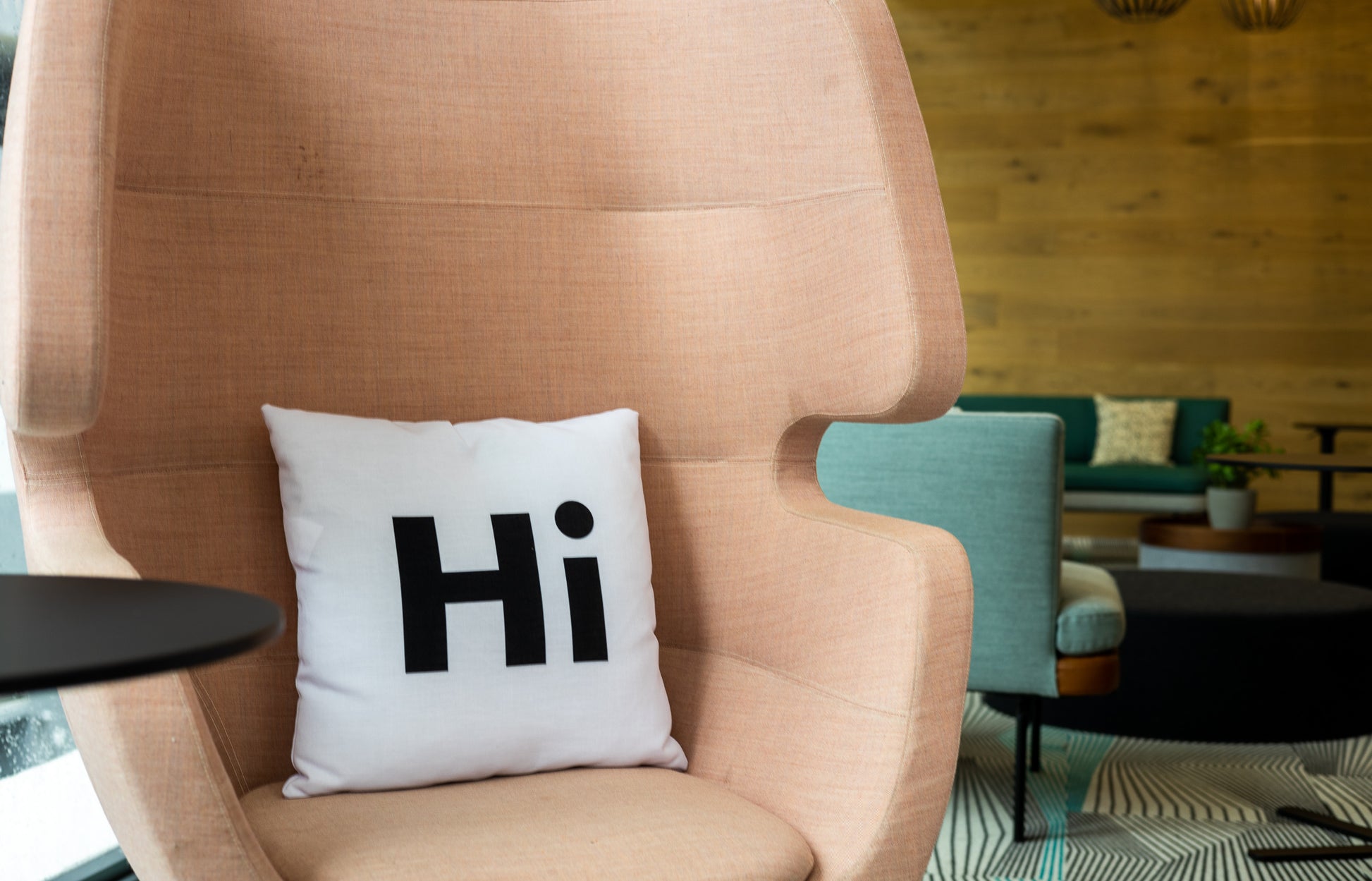 Hi Pillow by Hi Johnny in white in a coworking space lounge area